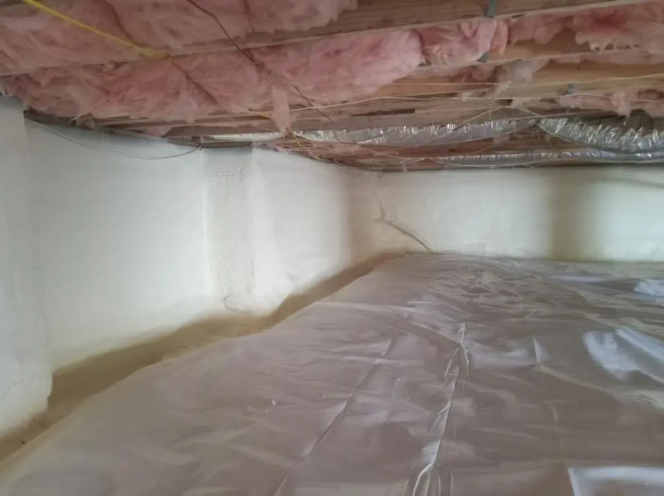 Crawl space encapsulation with closed-cell spray foam for Commercial Roof Restoration in Phillipsburg